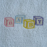 embroidered blocks on baby blanket