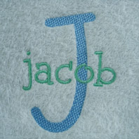 embroidered boys name on baby blanket with white trim