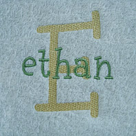 embroidered name on baby blanket with blue trim